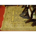 A Persian woollen buff ground prayer rug, having all over geometric floral stylised decoration