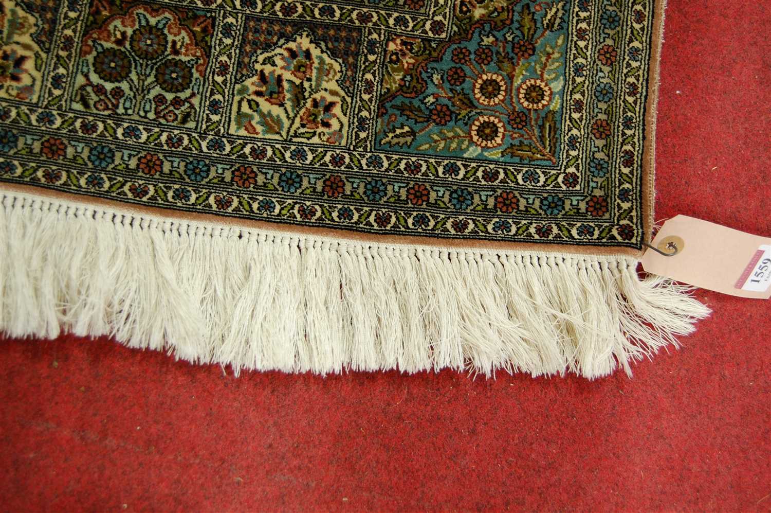 A Persian woven silk rug, having five rows of boxed reserves within multiple trailing tramline - Image 3 of 3