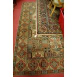 A Persian style machine-woven woollen carpet; and one other (2)