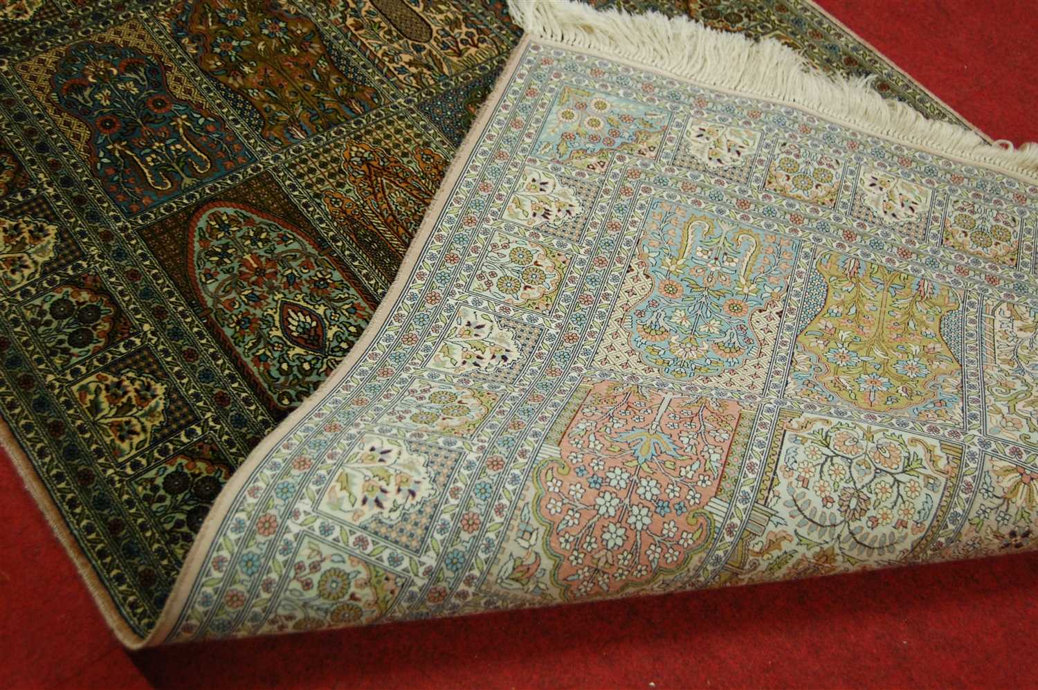 A Persian woven silk rug, having five rows of boxed reserves within multiple trailing tramline - Image 2 of 3