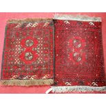 Two Persian red ground Bokhara prayer rugs