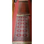 Two small contemporary Persian machine-woven red ground Bokhara rugs