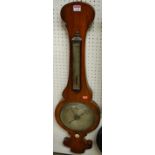 An early Victorian rosewood onion topped two dial wheel barometer