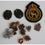 A small collection of miscellaneous badges, to include Army Service Corps enamelled lapel badge,