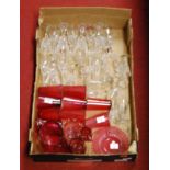 A box of miscellaneous glassware to include cranberry glass lemonade set, Waterford liqueur