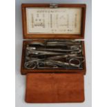 A reproduction Japanese field surgeon's kit, in fitted box, with character marks to lid and