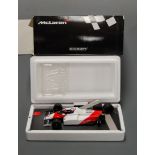 A Minichamps 1:18 scale resin model of a Maclaren Ford MP4/1C 1983 F1 racing car, winner of the