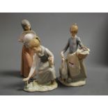A Lladro porcelain figure of a girl feeding geese, printed mark verso, impressed I27, height 25cm,