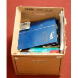 A box of assorted Stanley Gibbons stamp catalogues, various stamp albums, loose stamps etc