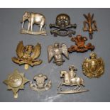 A small collection of cap badges, to include Queens Royal Lancers, Glamorgan Yeomanry, Earl of