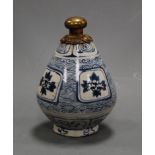 A 19th century Chinese stoneware blue and white vase, having four central reserves of flowers (cut