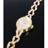A mid century ladies Swiss 9ct gold quartz dress watch on fancy gold bracelet, gross weight 7.6g,