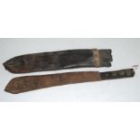 A British Army(?) military machete, the 38cm blade dated 1917, housed in a leather sheath