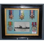 A framed group of five medals, to include 1939-45 Star, Atlantic Star, France and Germany Star,