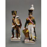 An early 20th century continental porcelain figure of a Napoleonic soldier, in standing pose with