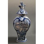 A 19th century Dutch Delft blue and white vase and cover, of baluster form, decorated in the Chinese