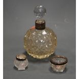 A circa 1900 hobnail cut glass scent bottle, with associated stopper, having silver collar; together