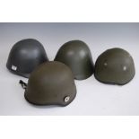 Two Danish M23/41 steel military helmets, each with leather lining and chin strap; together with