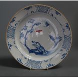 An 18th century Liverpool delft blue and white plate, the centre decorated with Chinese figures