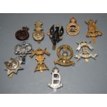 A small collection of assorted cap badges, to include 9th Lancers, The Lifeguards, 12th Dragoons etc