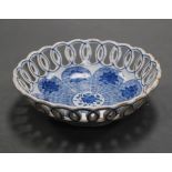 An 18th century Dutch delft blue and white chestnut basket, of pierced circular form, dia.17cm (