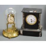 An Edwardian black slate and marble cased mantel clock, having enamelled dial with Roman numerals,