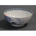 A large 18th century Worcester blue and white bowl, decorated with buildings amidst flowers and