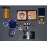 A small collection of assorted lapel badges and jewels, to include silver and enamelled Rifle