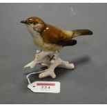 A Karl Ens Volkstedt Pottery model of a German warbler, No.7437, h.10.5cm