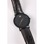 A lady's Movado quartz wristwatch, the round black dial with gilt hands and dot marker, 30mm
