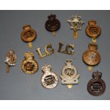 A small collection of cap badges and insignia, to include The Lifeguards, Queens Own Hussar's, Blues