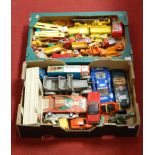 Two trays containing a quantity of playworn tinplate and diecast toy vehicles, to include