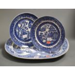 A large Victorian ironstone blue and white meat plate transfer decorated in the Chinese taste,