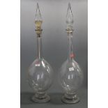 A pair of large early 20th century apothecary display decanters and stoppers, h.68cm