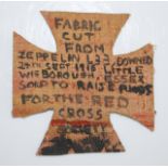 A canvas cross, hand-written verso 'Fabric cut from Zeppelin L33, downed 24th September 1916, Little