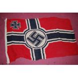 A German Kriegsmarine battle flag, stamped Reichskriegsflg to the lanyard and dated 1939, 85 x 50cm