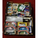 Four trays containing a quantity of mainly modern issue diecast and tinplate vehicles, to include