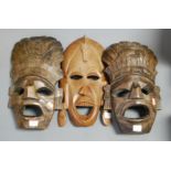 A carved softwod tribal wall mask; together with two others (3)