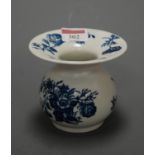 An 18th century Worcester blue and white spittoon, printed in underglaze blue in the Three Flowers