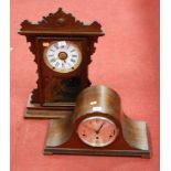 A late 19th century American stained pine cased mantel clock, having enamelled dial with Roman