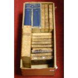 A box of assorted 19th century and later leather bound books, to include Holy Bible, The