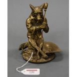 A brass novelty desk stand, modelled as the wolf from Little Red Riding Hood, height 15cm