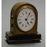 A Victorian lacquered brass cased mantel clock, of lancet form, having an oval enamelled dial with