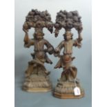 A pair of 19th century carved lime wood? figures each in the form of a young girl in standing pose