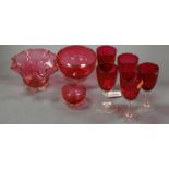 A set of five Victorian cranberry glass wines together with three small bowls (8)