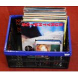 A box of popular LPs, 12 & 7" singles