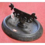 A Victorian cast iron boot-scraper