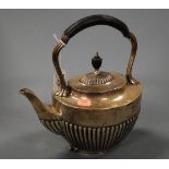 A late Victorian silver spirit kettle (lacking stand), being of half reeded oval form, ebony handle,