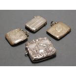 A late Victorian silver vesta, of hinged rectangular form, having embossed floral and C-scroll