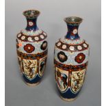 A pair of large Japanese late Meiji period cloisonne vases of baluster form decorated with panels of